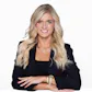 woman in black blazer with long blonde hair and bright smile