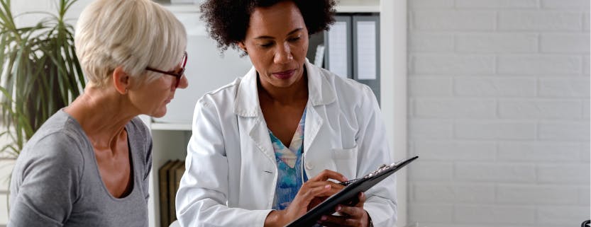 Doctor talking with a female patient