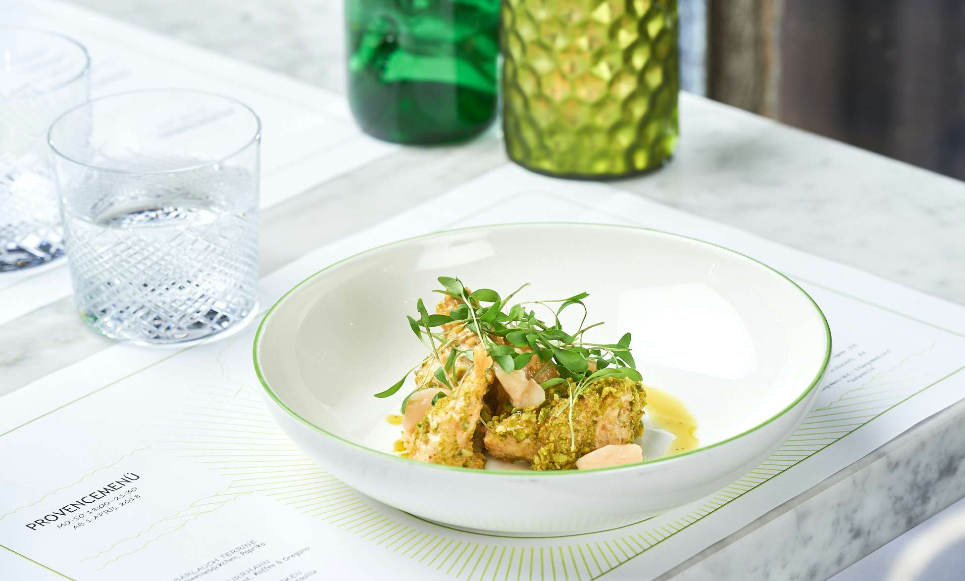 Table at the Brasserie Colette by Tim Raue with a main dish. 