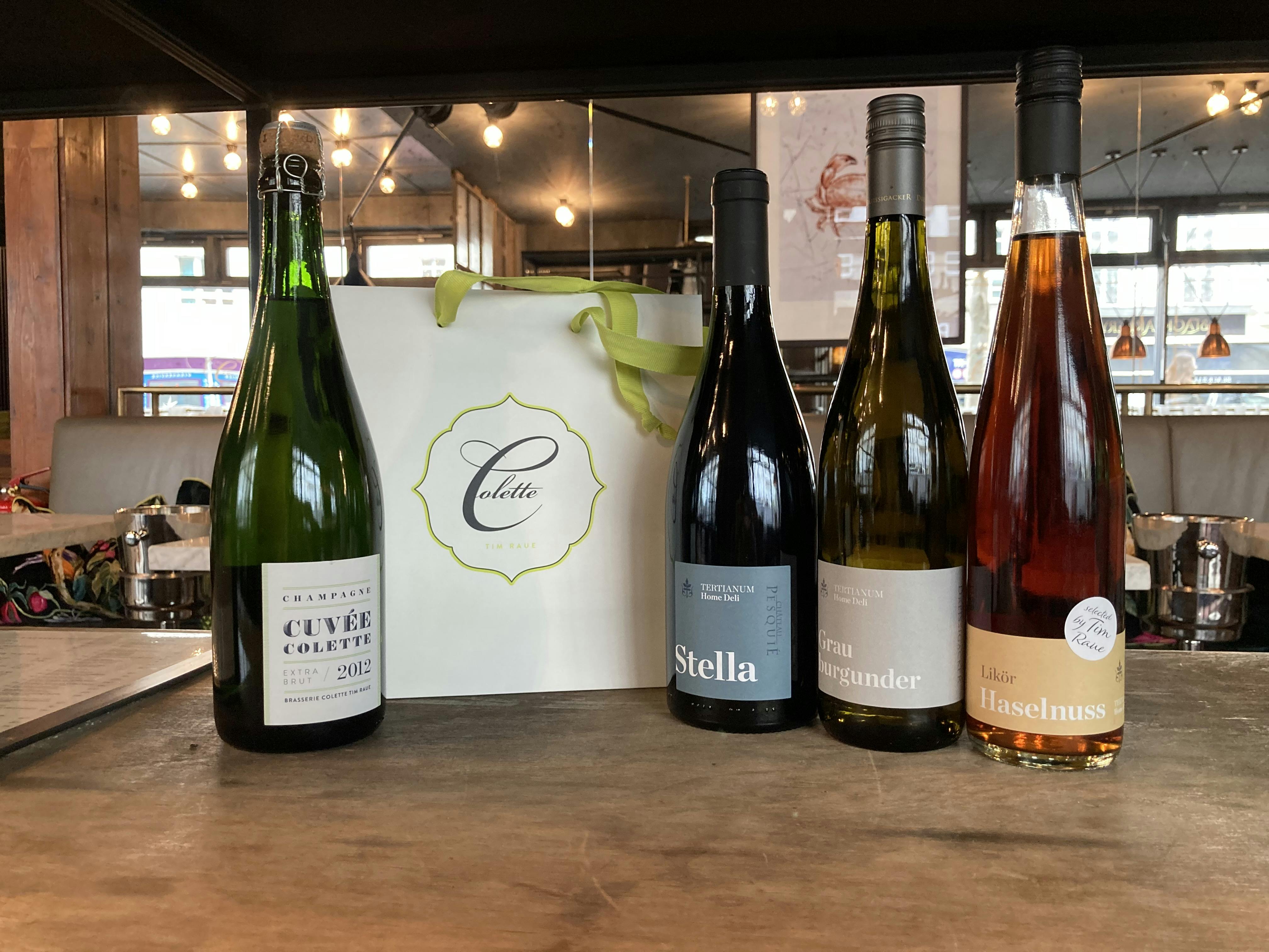 Brasserie Colette Geschenktasche mit vier Flaschen: Wein, Champagner und Haselnusslikör