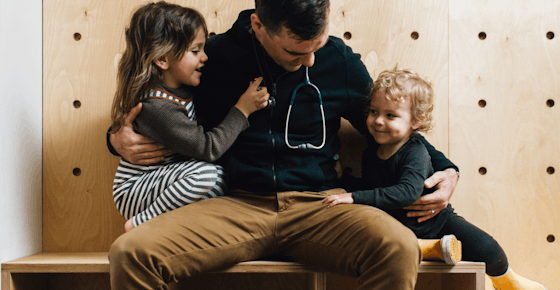 Doctor sitting with kids