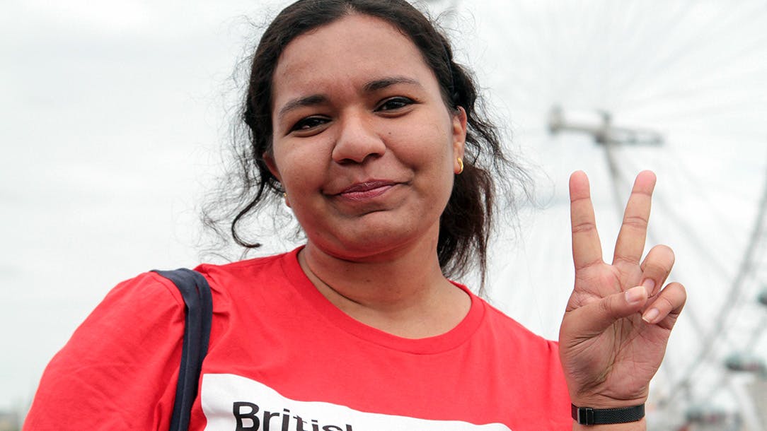 Walker gives peace sign during Walk for Humanity London event.