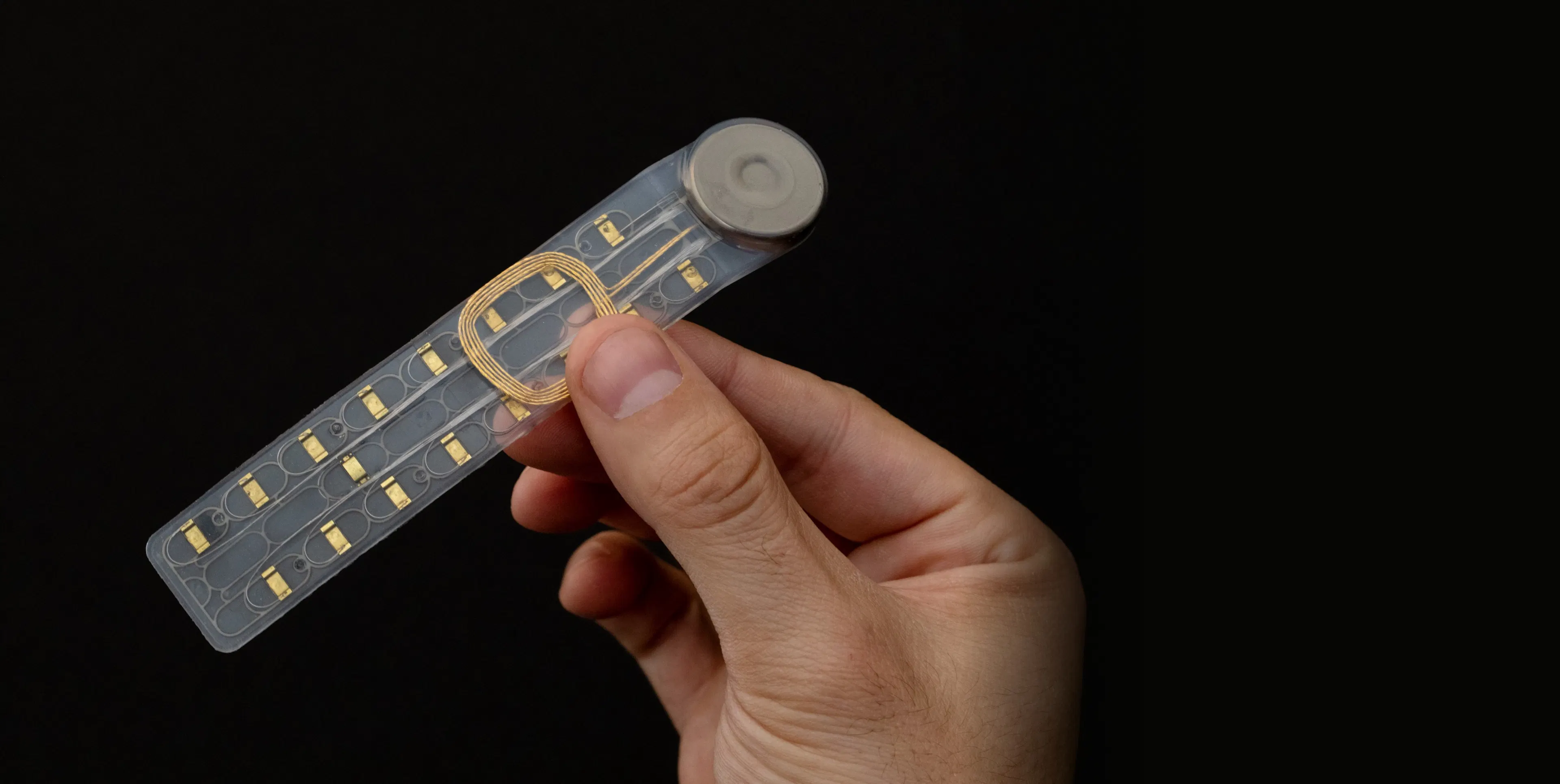 Microfluidic chip held between fingers