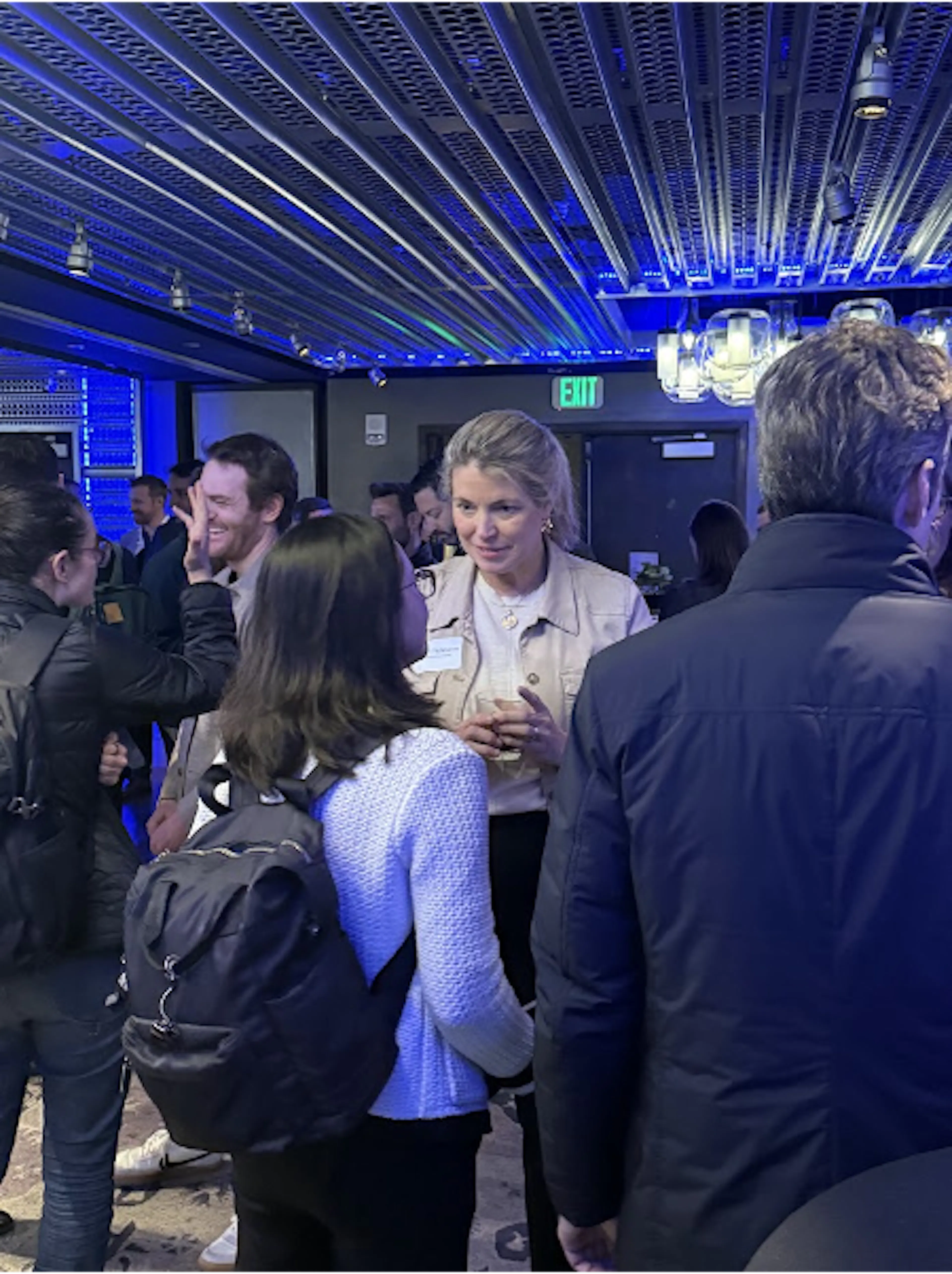 Breakout Ventures community members talking at an indoor gathering