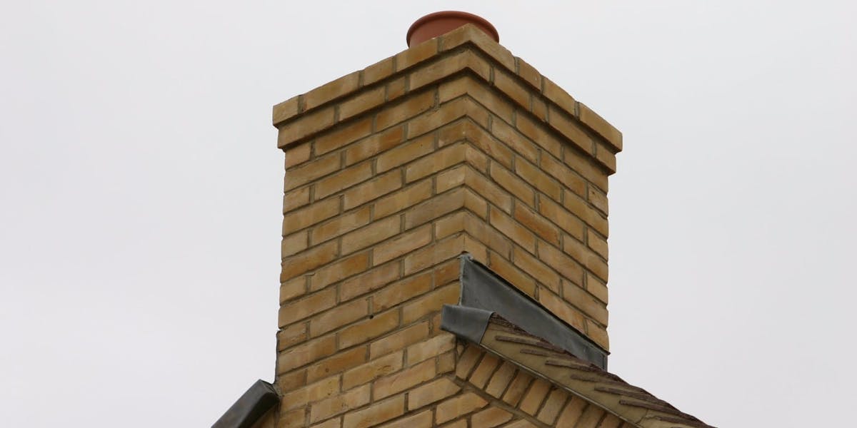 A pre-fabricated chimney placed at the gable end