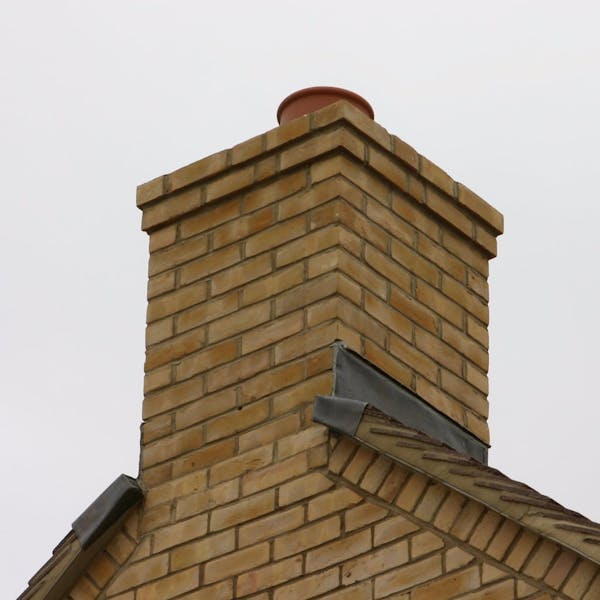 A pre-fabricated chimney placed at the gable end