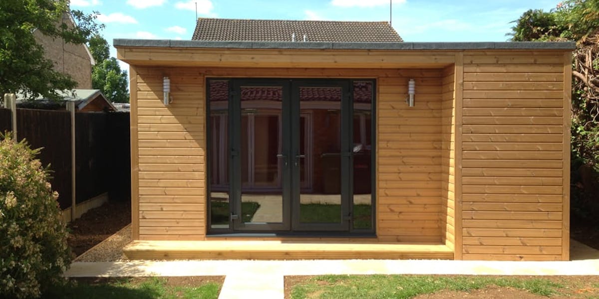 Domestic swimming pool house clad in Thermowood