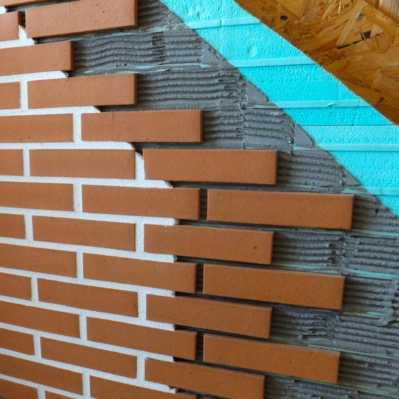 Cross section display of brick cladding, substrates and Candi wall system