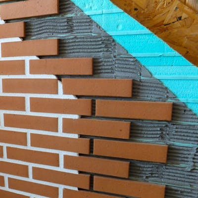 Cross section display of brick cladding, substrates and Candi wall system