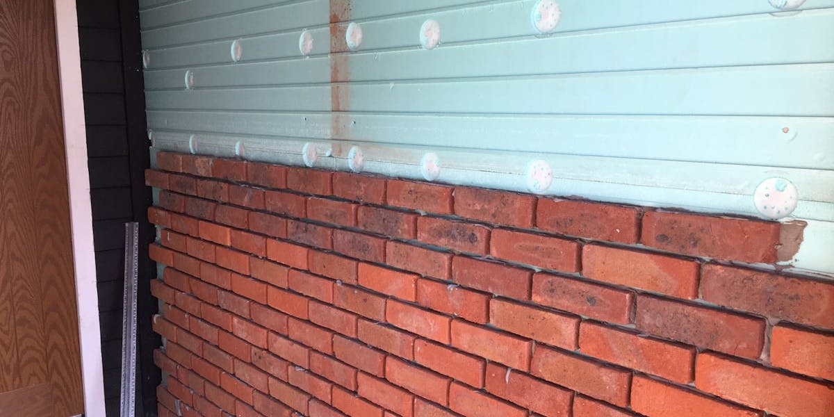 Red brick slip cladding using Candiwall on an internal structure detailing the thermal backing board