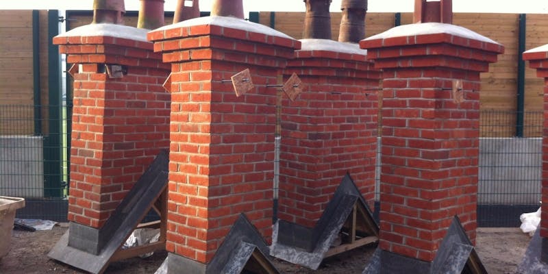 Pre-fabricated chimneys standing in a builders yard