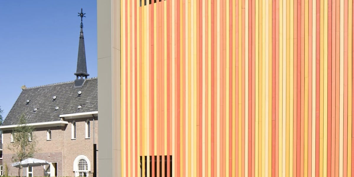 Colourful commercial building clad in Cape Cod Pre-Painted timber cladding