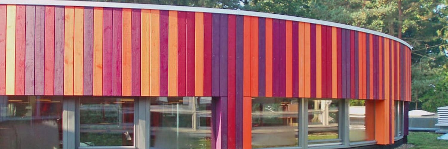 Colourful cape code painted timber on the exterior of a secondary school in the Netherlands