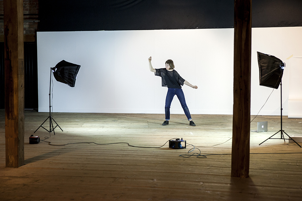 A visual artist being recorded.
