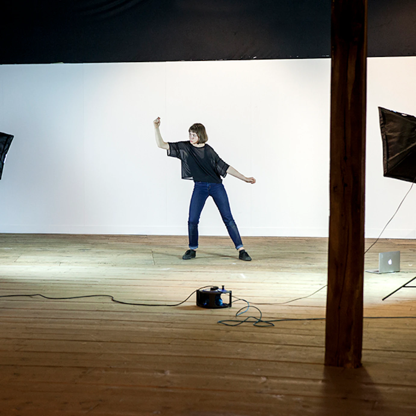 A visual artist being recorded.