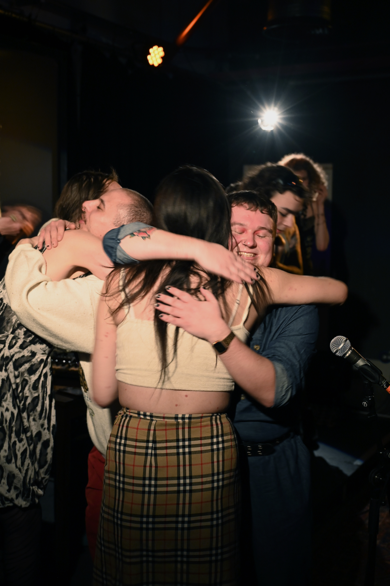 Residency artists hugging at the end of the show.