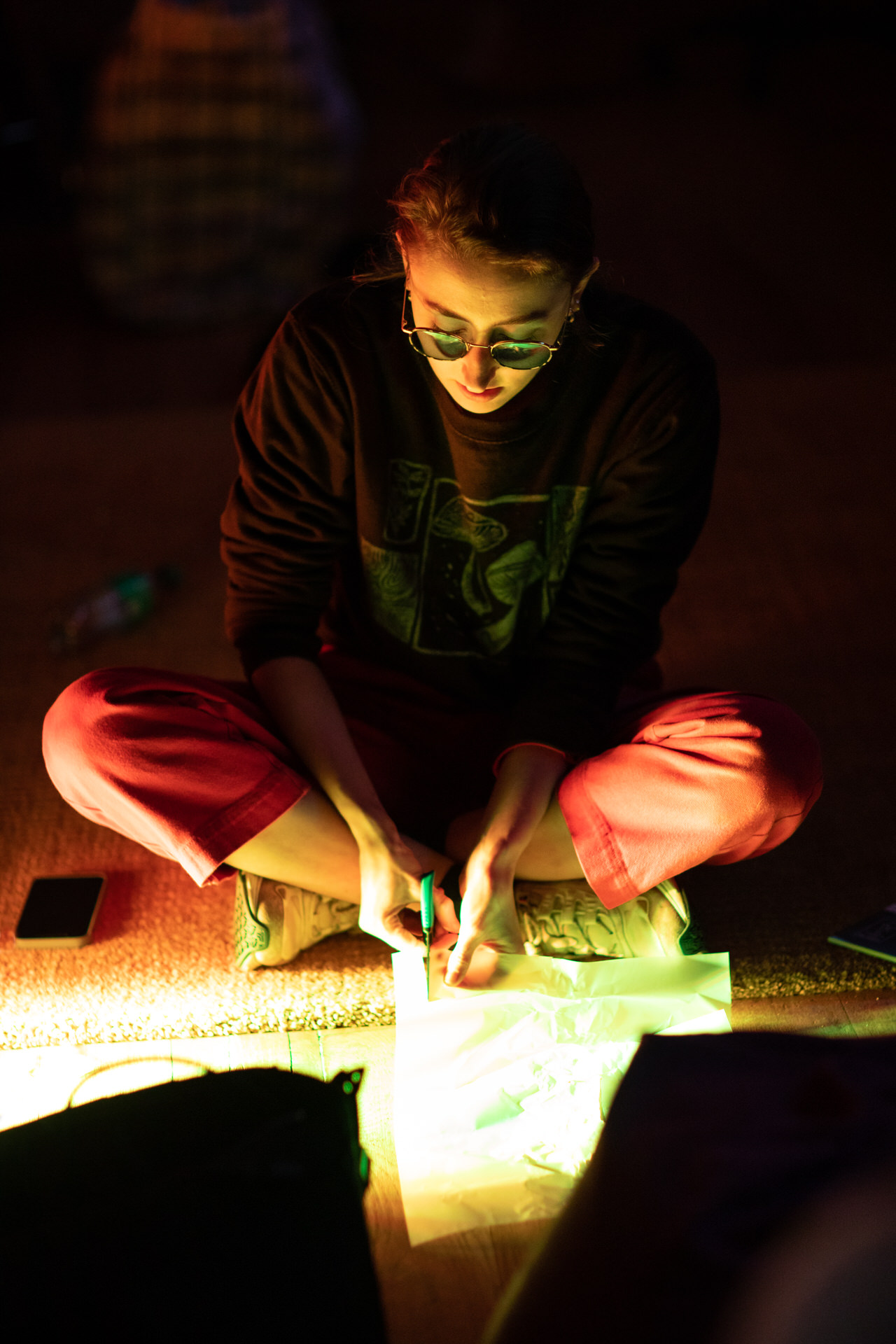 Rosie Woolaghan cutting into paper during the residency week at Self, Sense, Space.