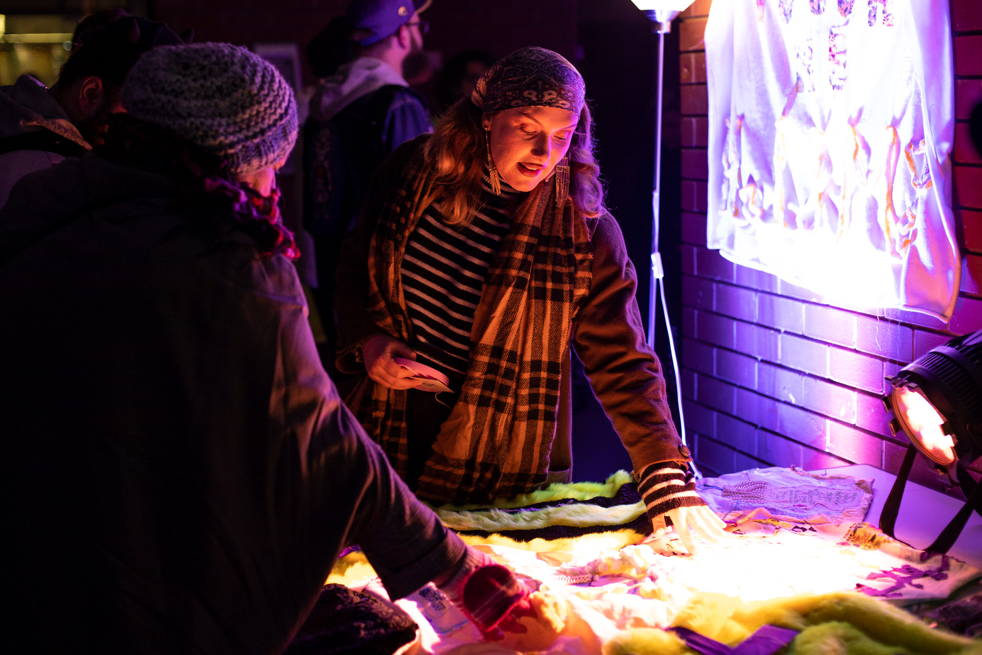 Audience members touching a fabric blanket created as part of Self, Sense, Space.