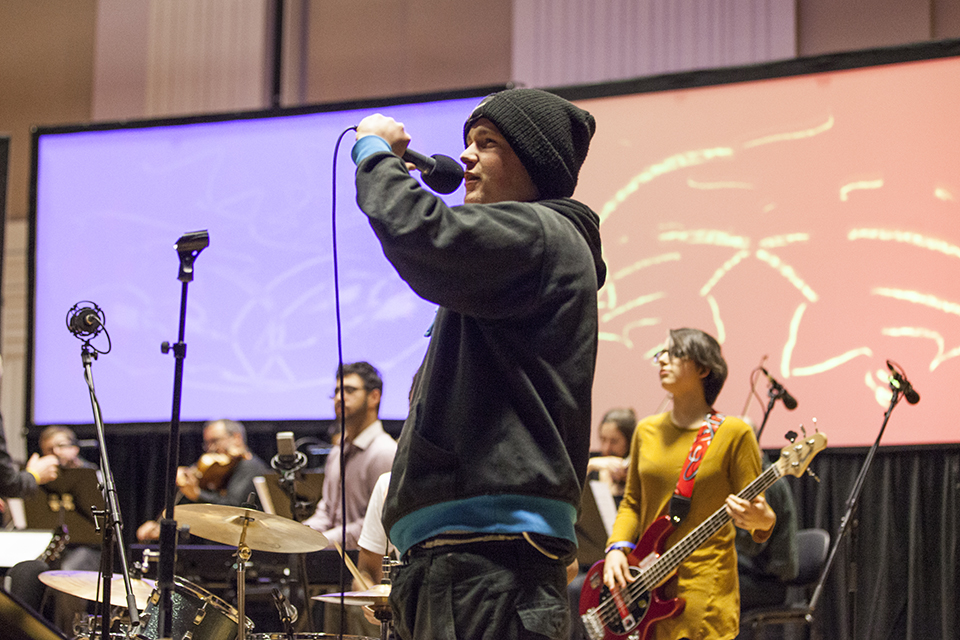 Musicians performing on stage.