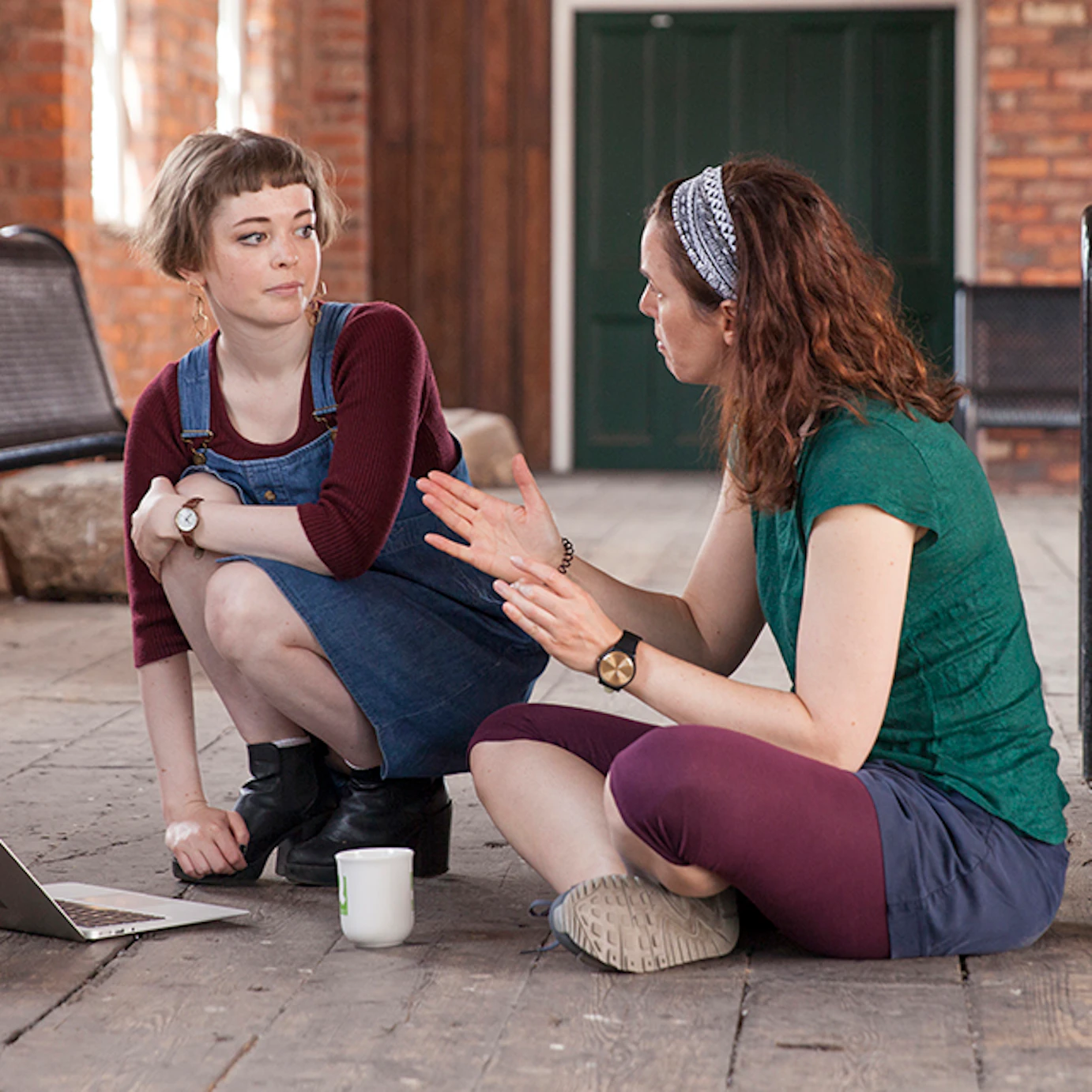 Anna Meredith chatting with a musician.