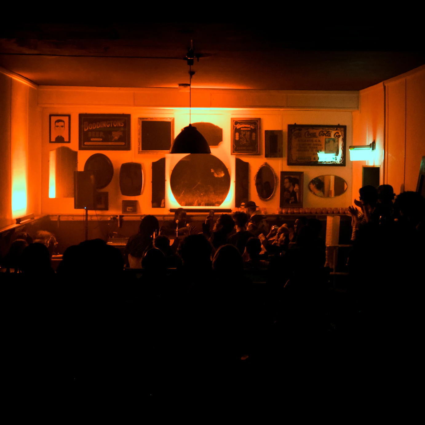 A wide shot of the crowd watching Daudi's performance.