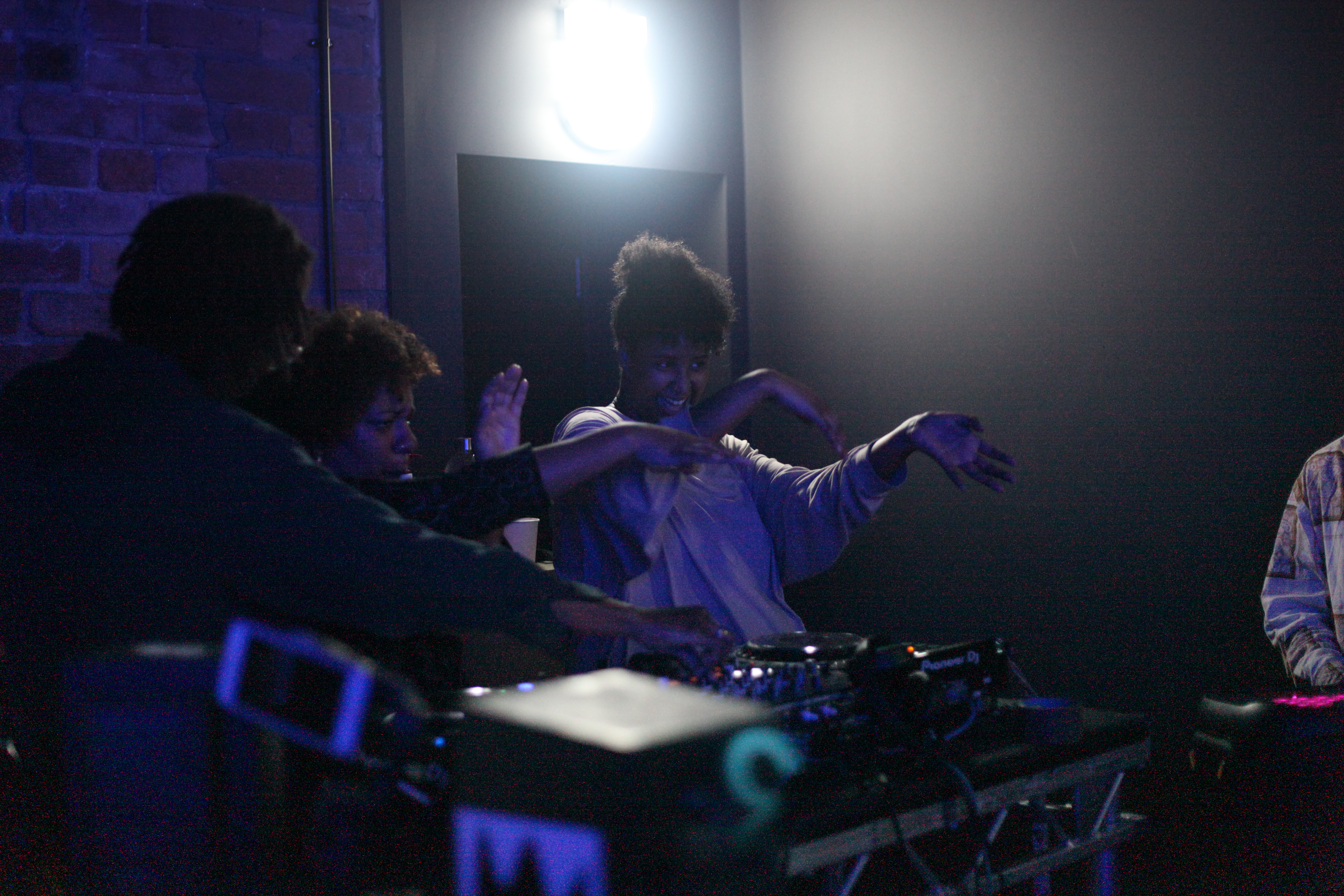 Afro Energy participants on the decks during the listening party.
