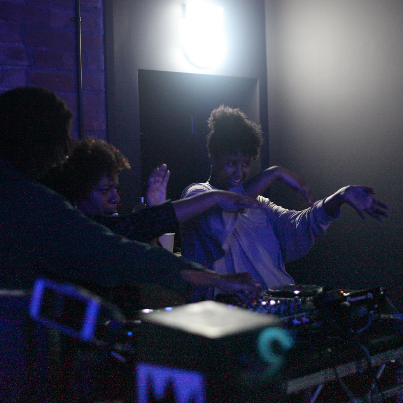 Afro Energy participants on the decks during the listening party.