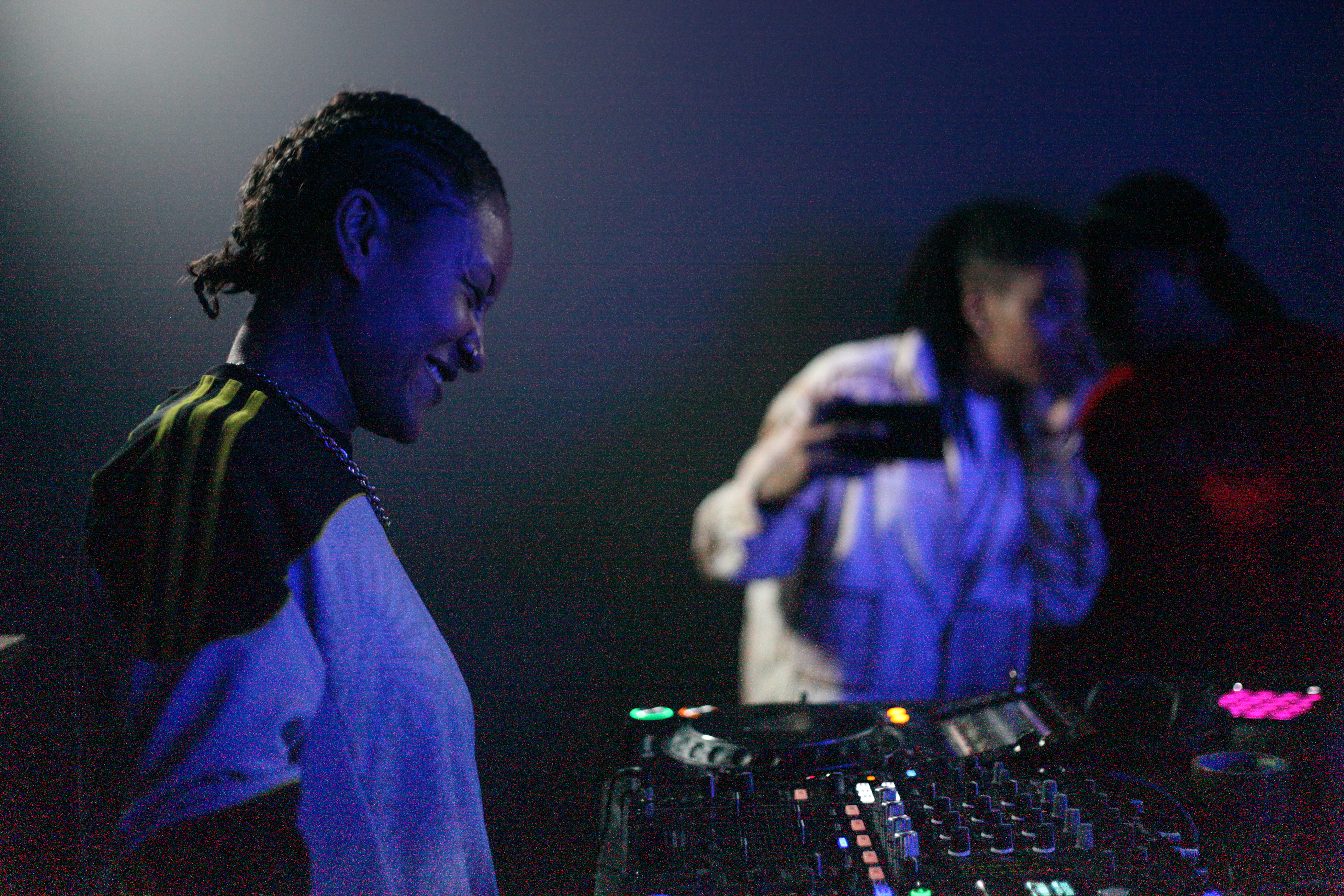 Afro Energy participants smiling on the decks during the listening party.