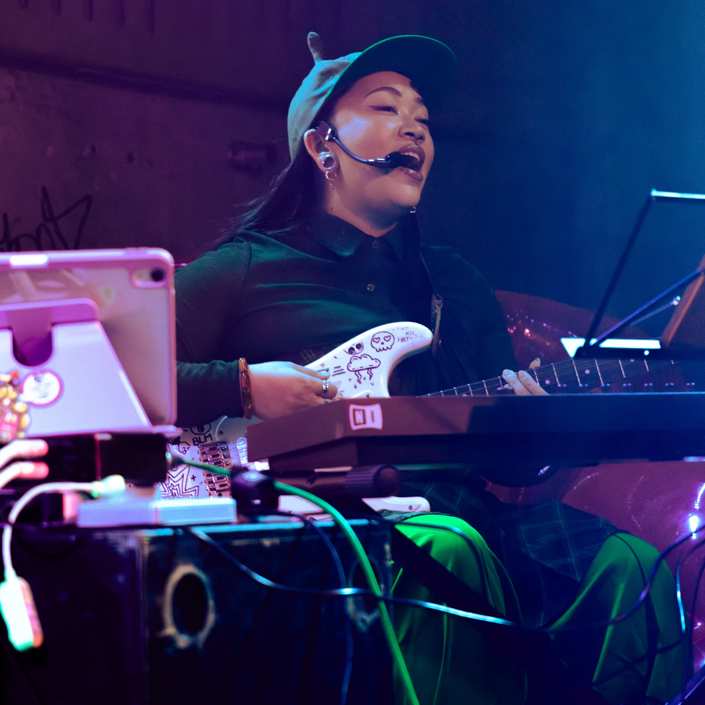 Kyami performing on stage.