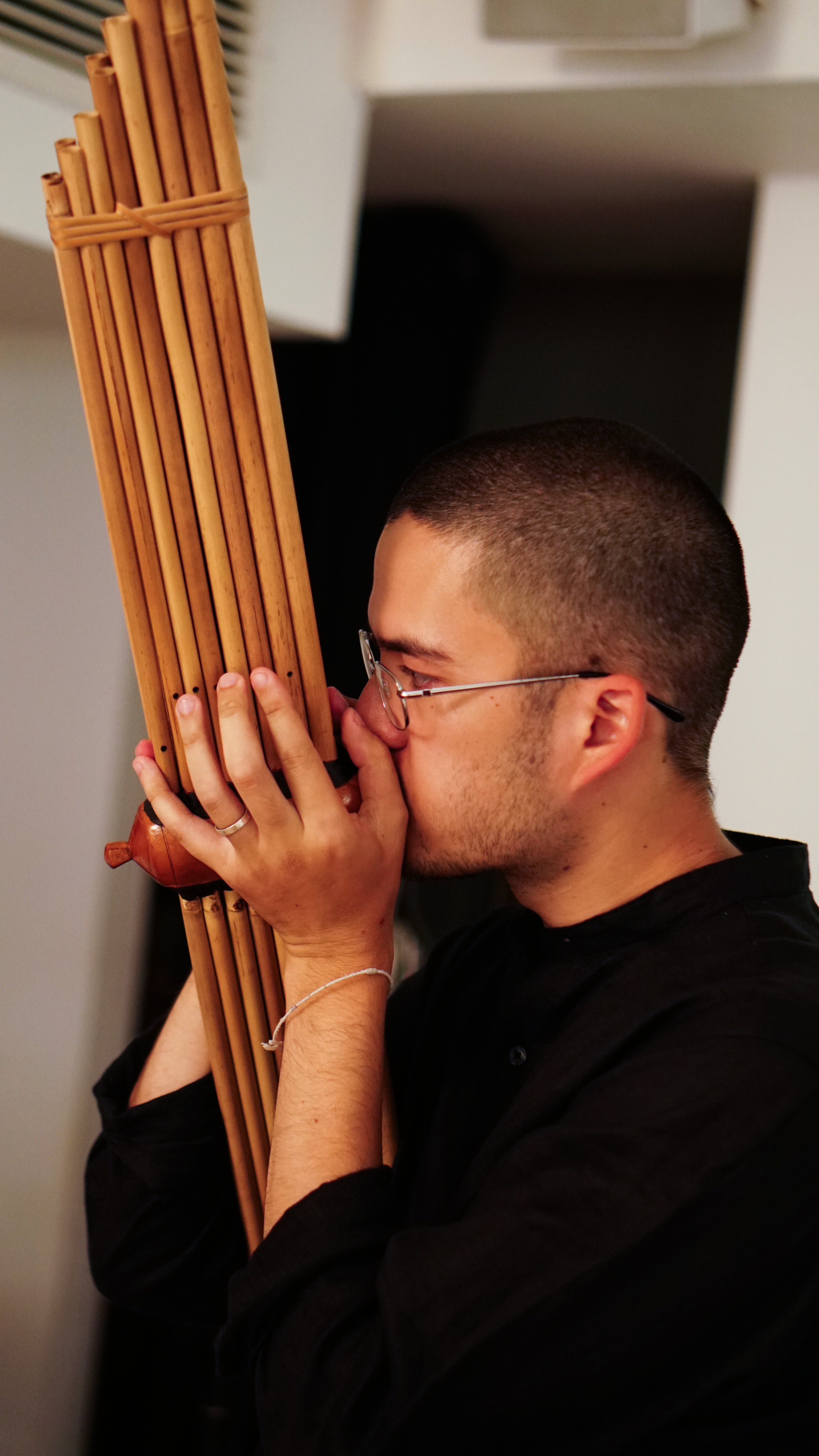 Kai playing the khaen in rehearsals.