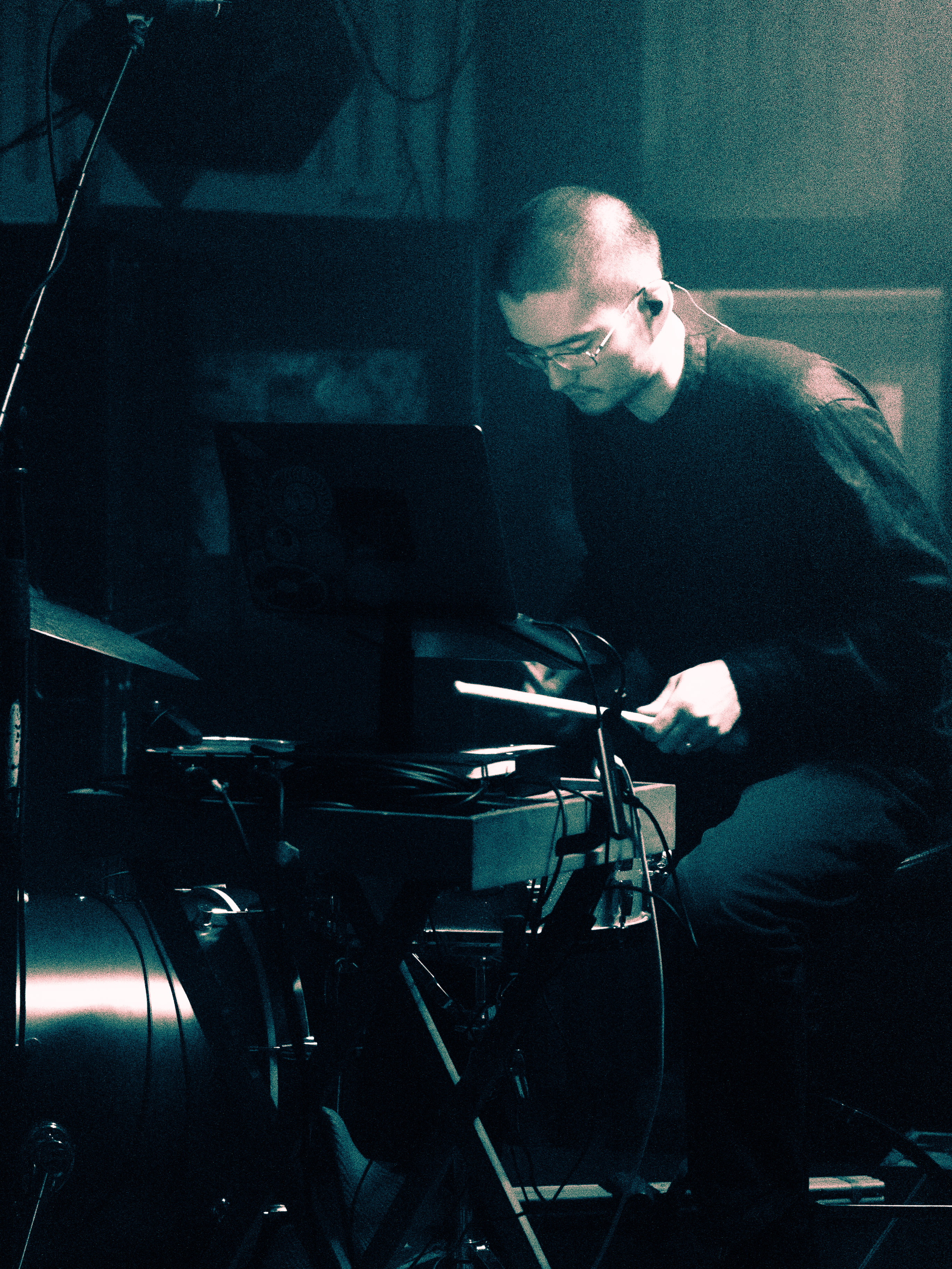 Kai drumming on stage.
