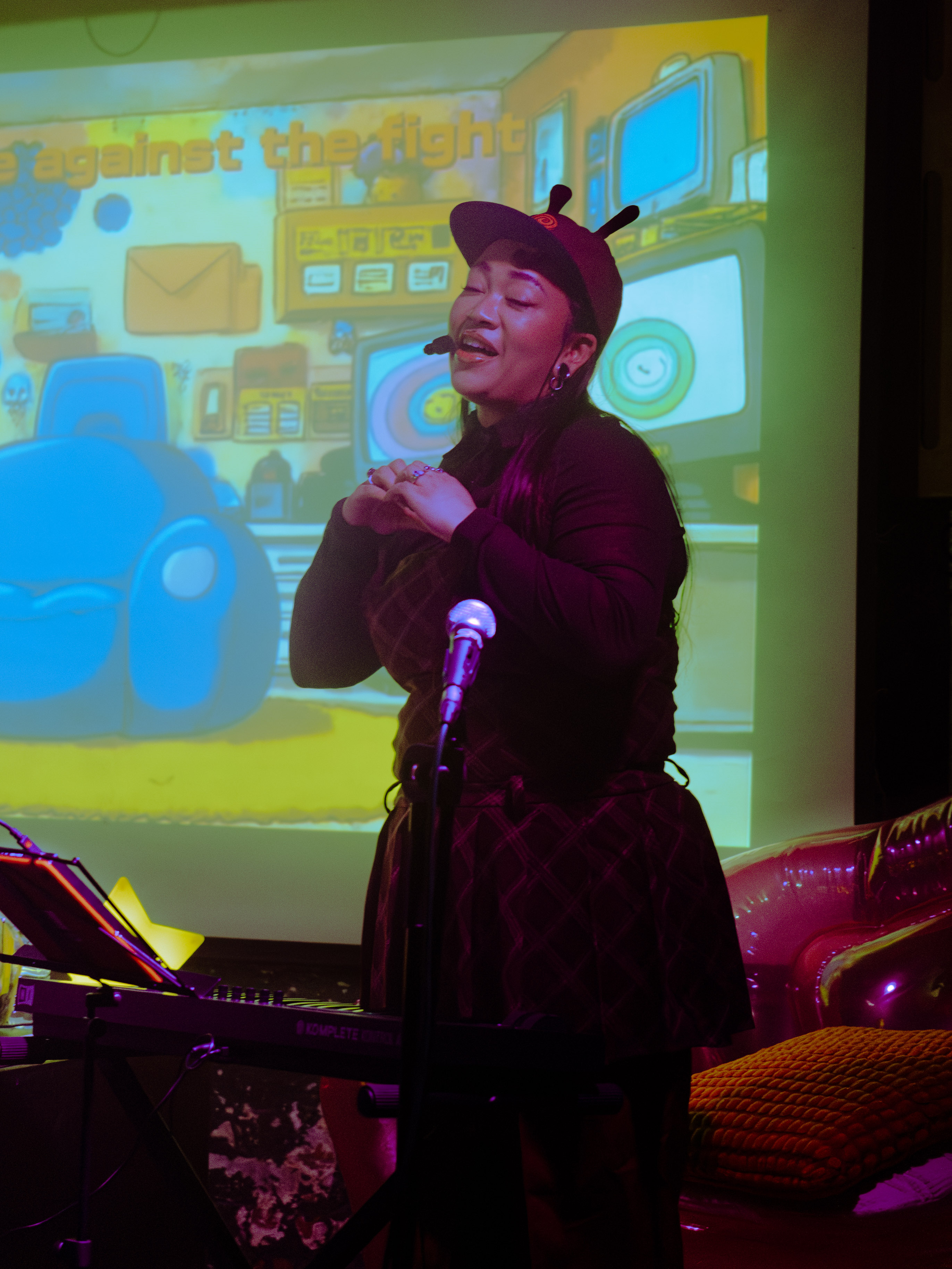 Kyami singing on stage.