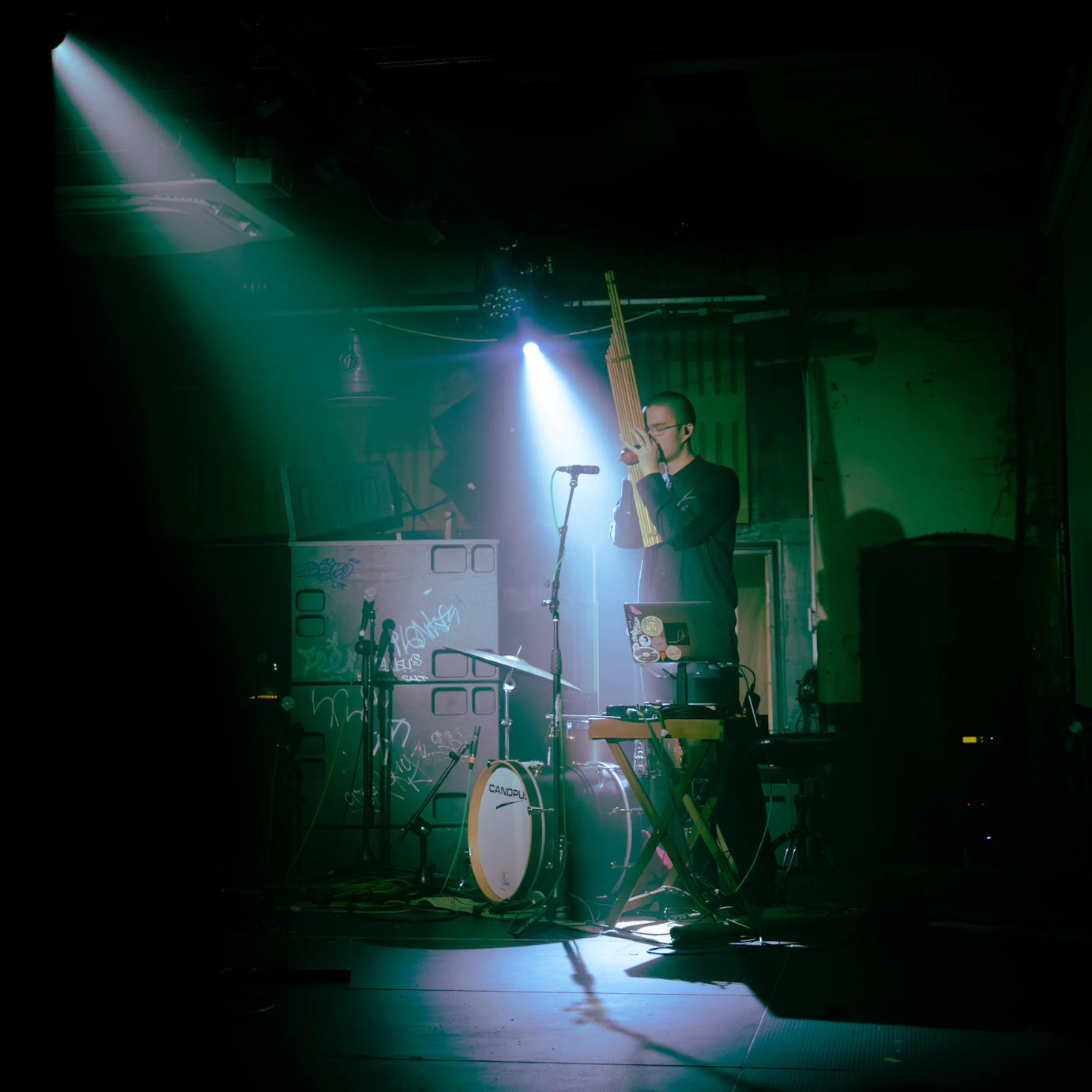 Kai playing the khaen on stage.