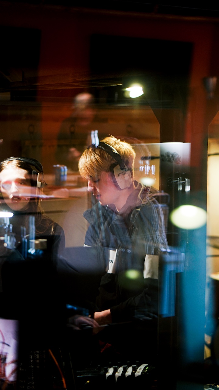 A young musician in VoltaLab with headphones on.