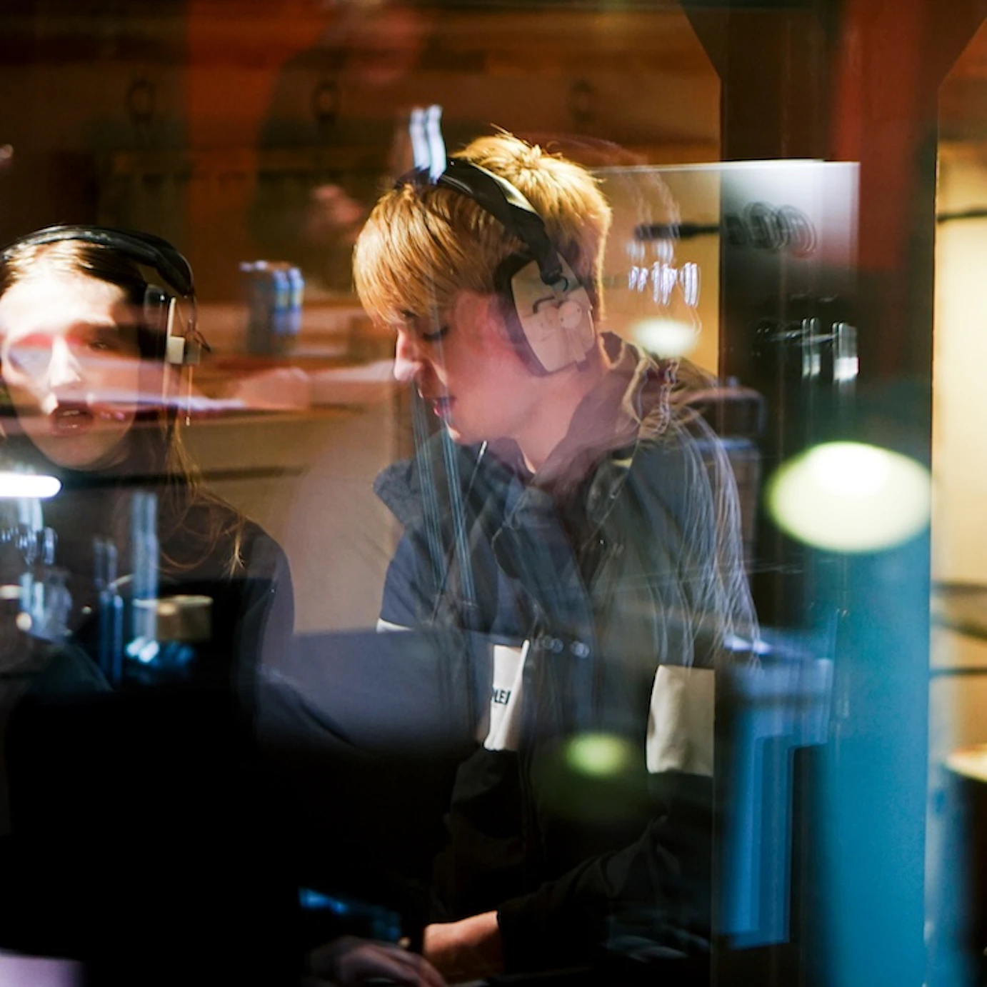 A young musician in VoltaLab with headphones on.