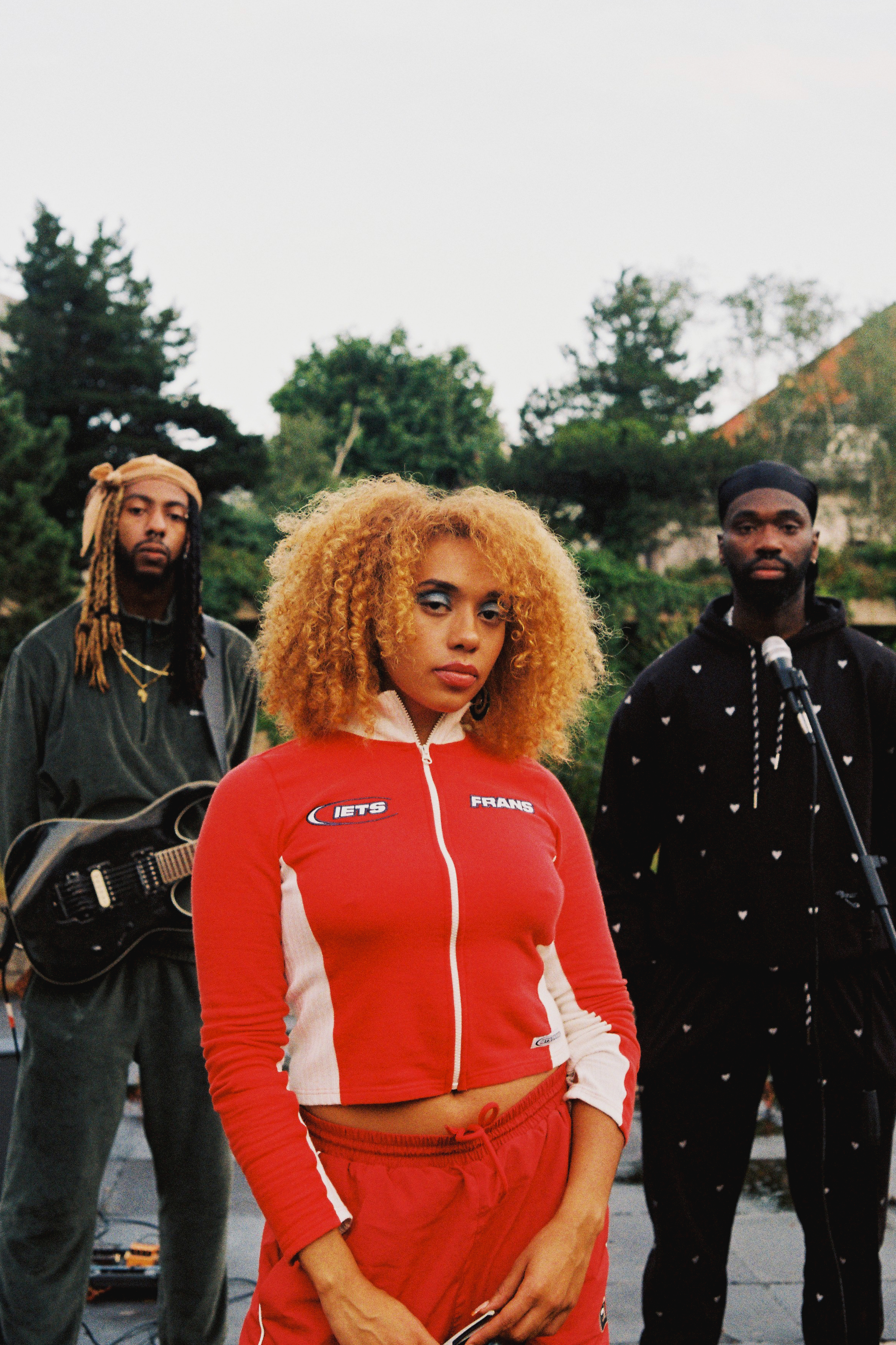 Third Kulture stood outside looking into the camera with straight faces.