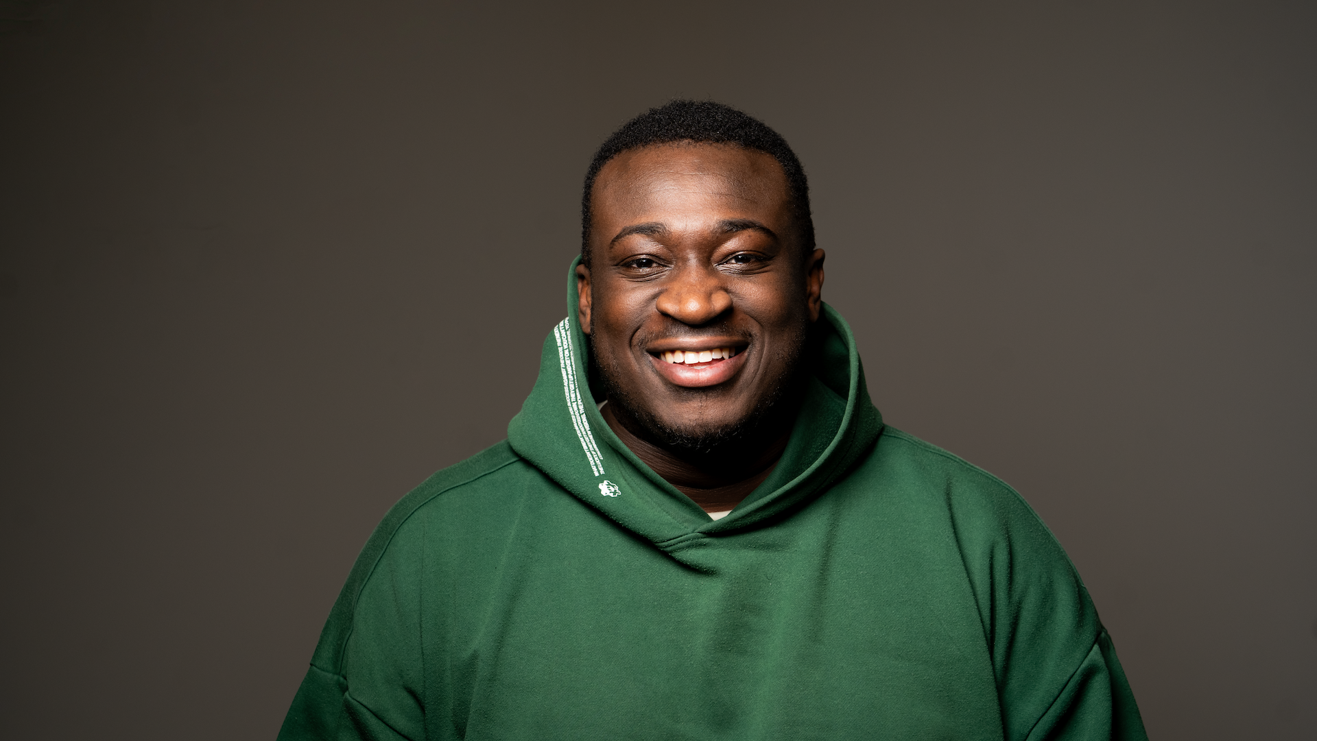 Danny West smiling to camera.