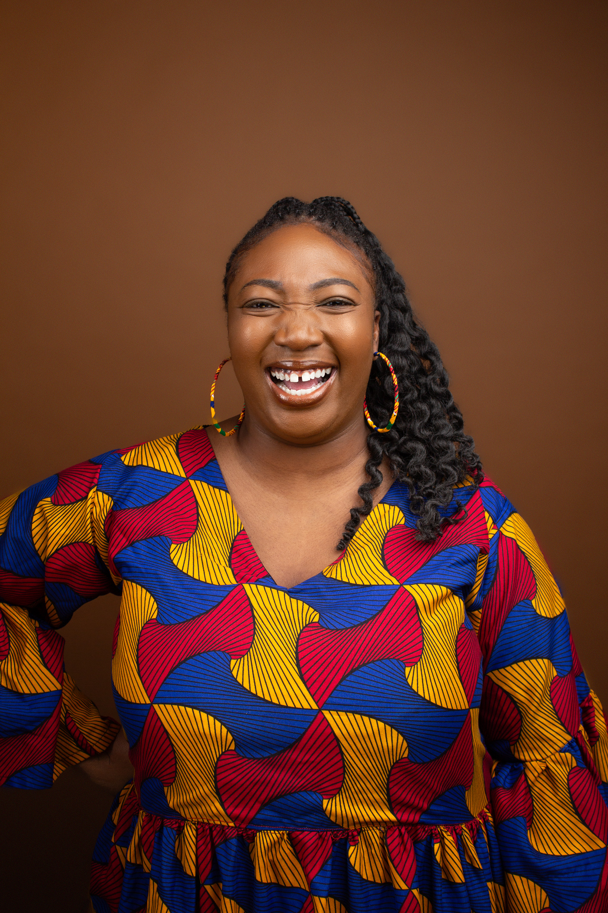 Adeola Adelakun smiling.