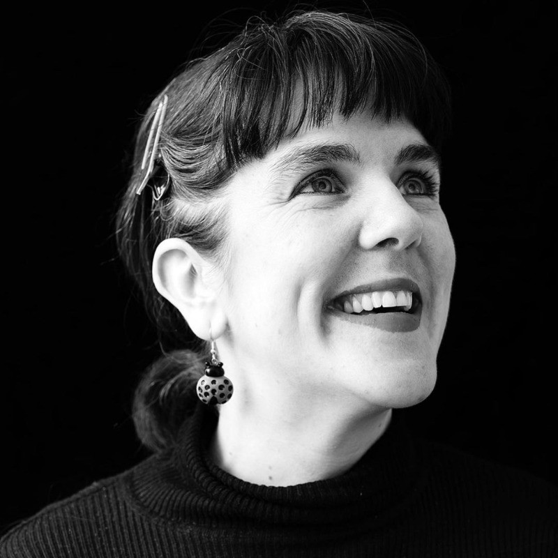 Katherine Cantwell smiling and looking off camera.