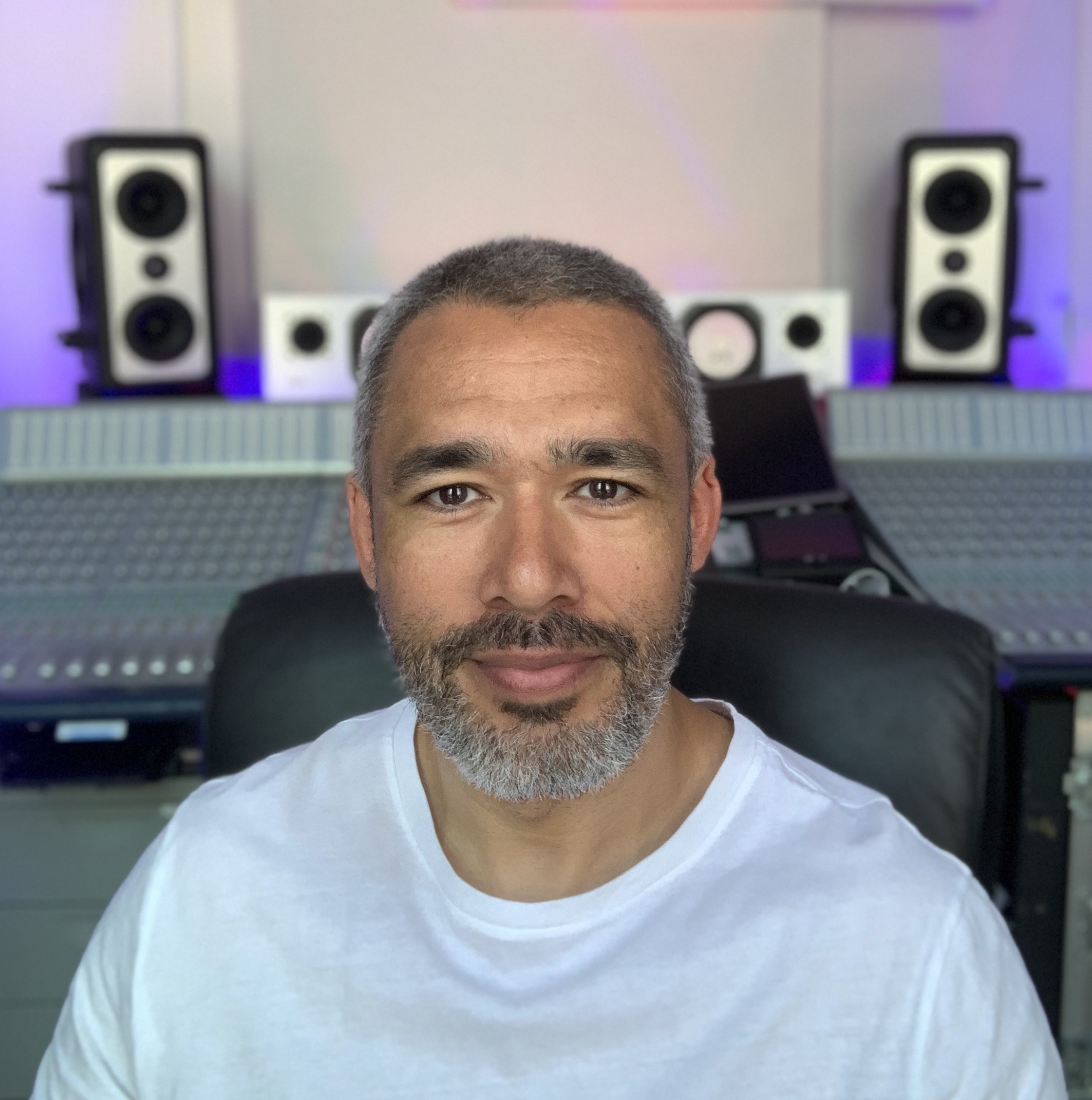 Mike Cave looking to camera in front of his studio.