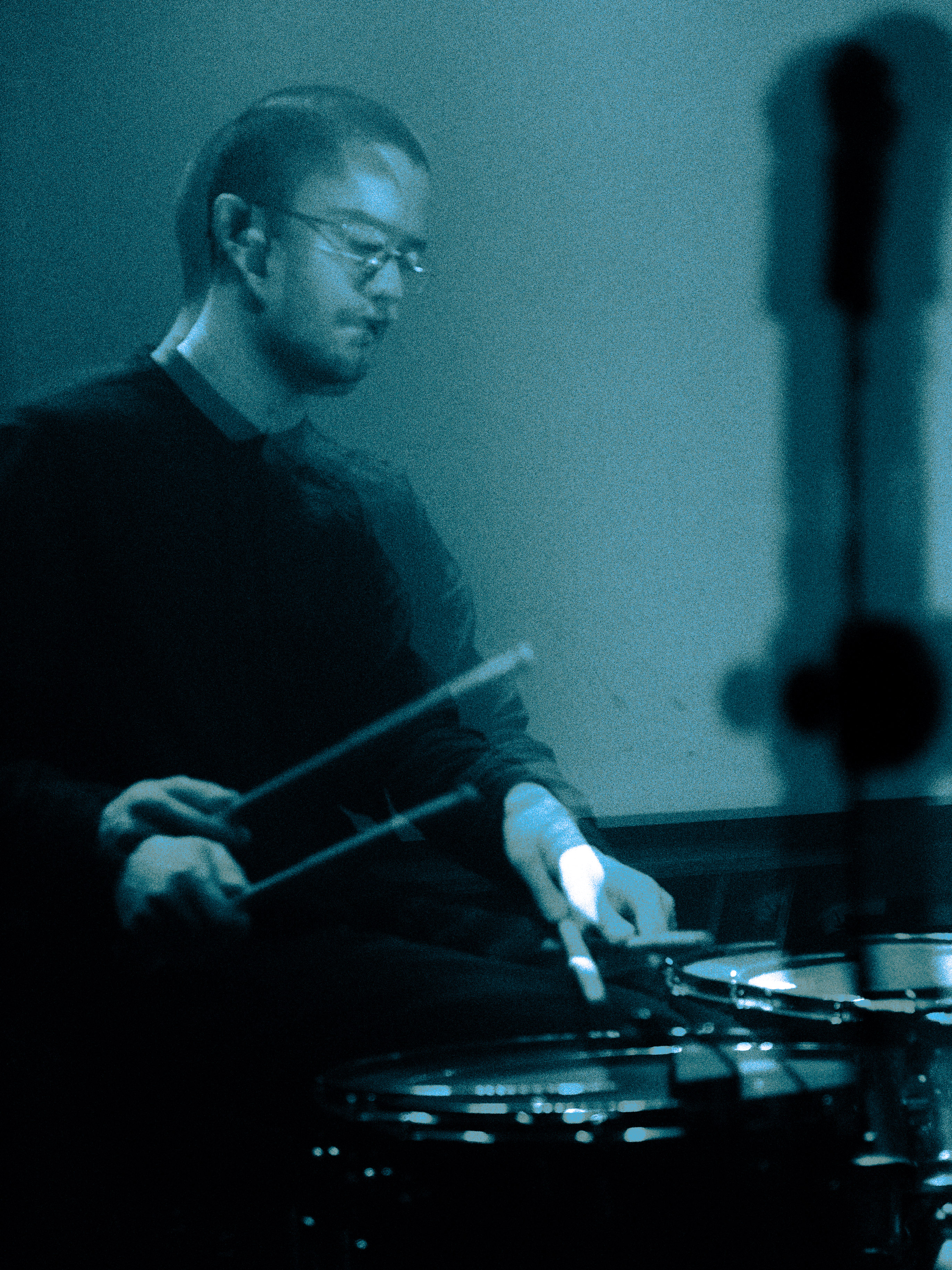 A blurred image of a drummer.