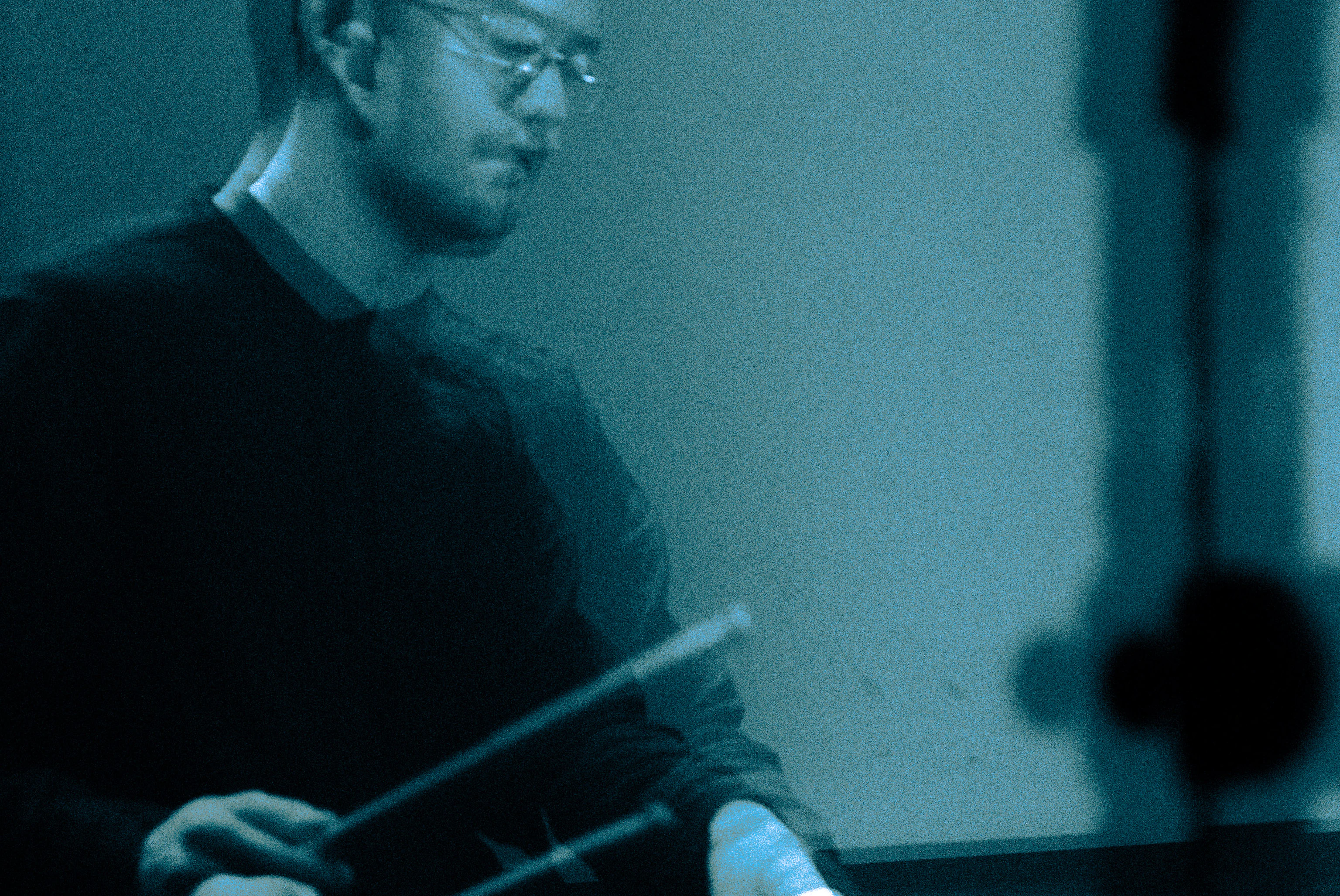 A blurred image of a drummer.