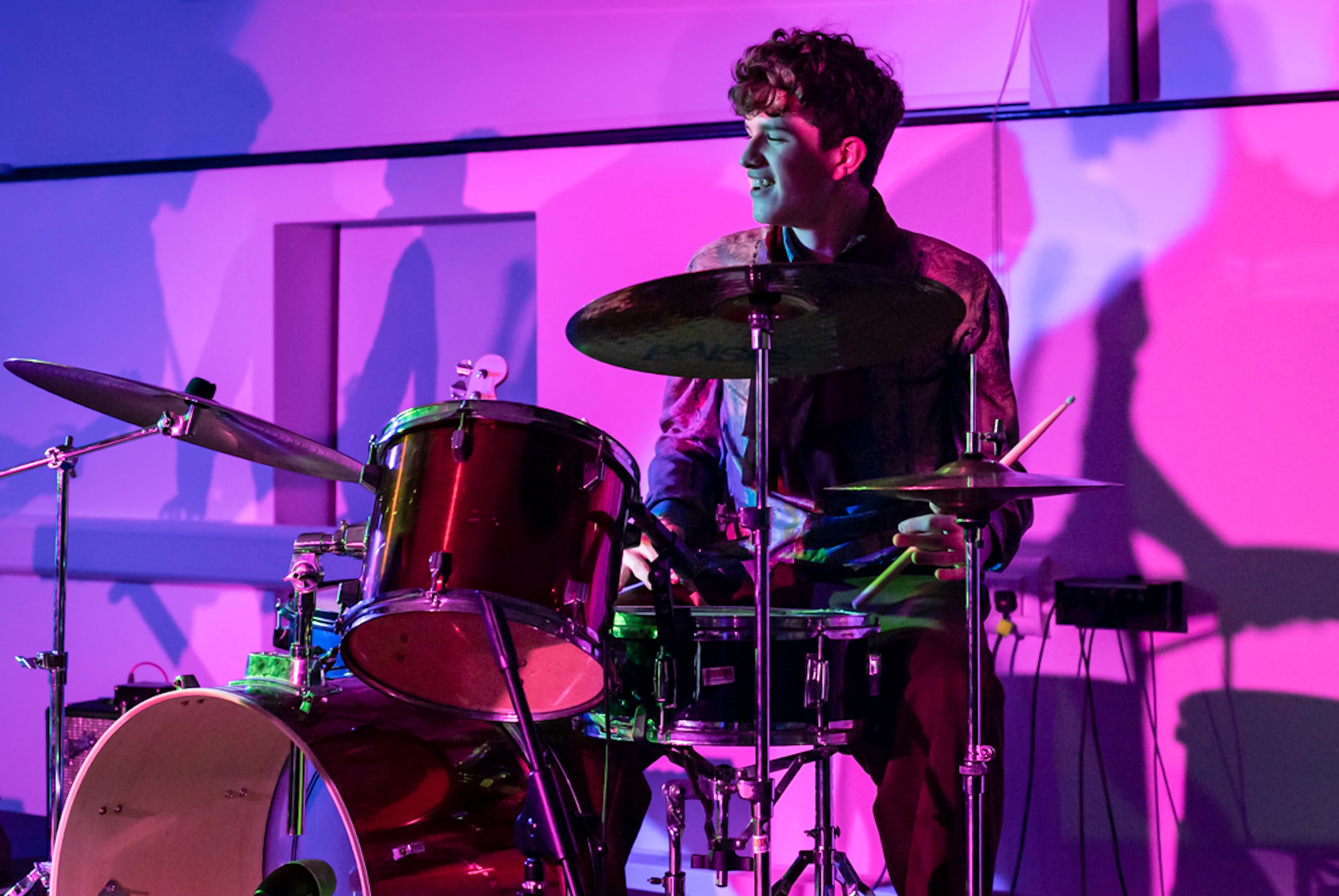 A young musician playing drums.
