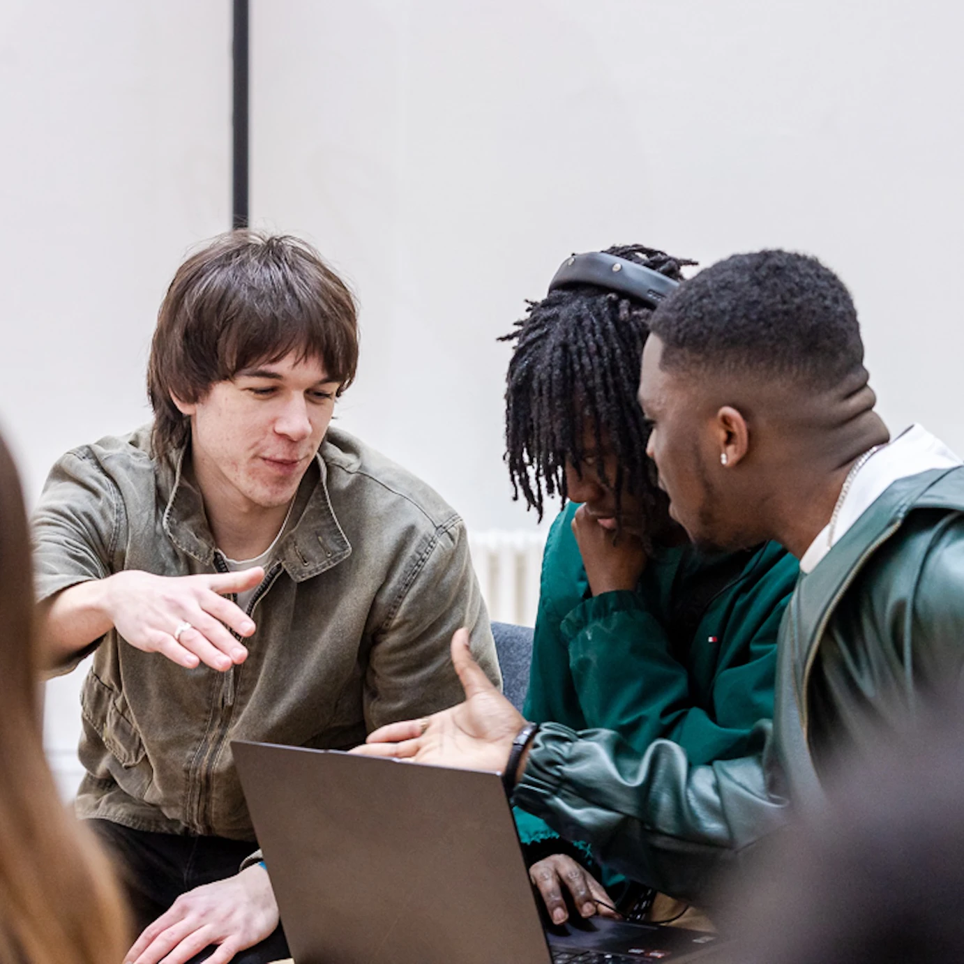 Young musicians shaking hands at a networking event.