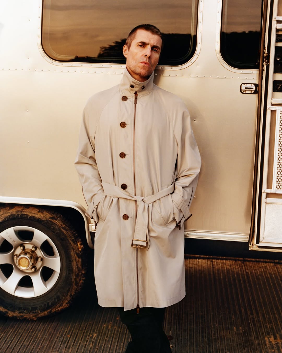 Photo of Liam Gallagher wearing a cream coloured Burberry mac