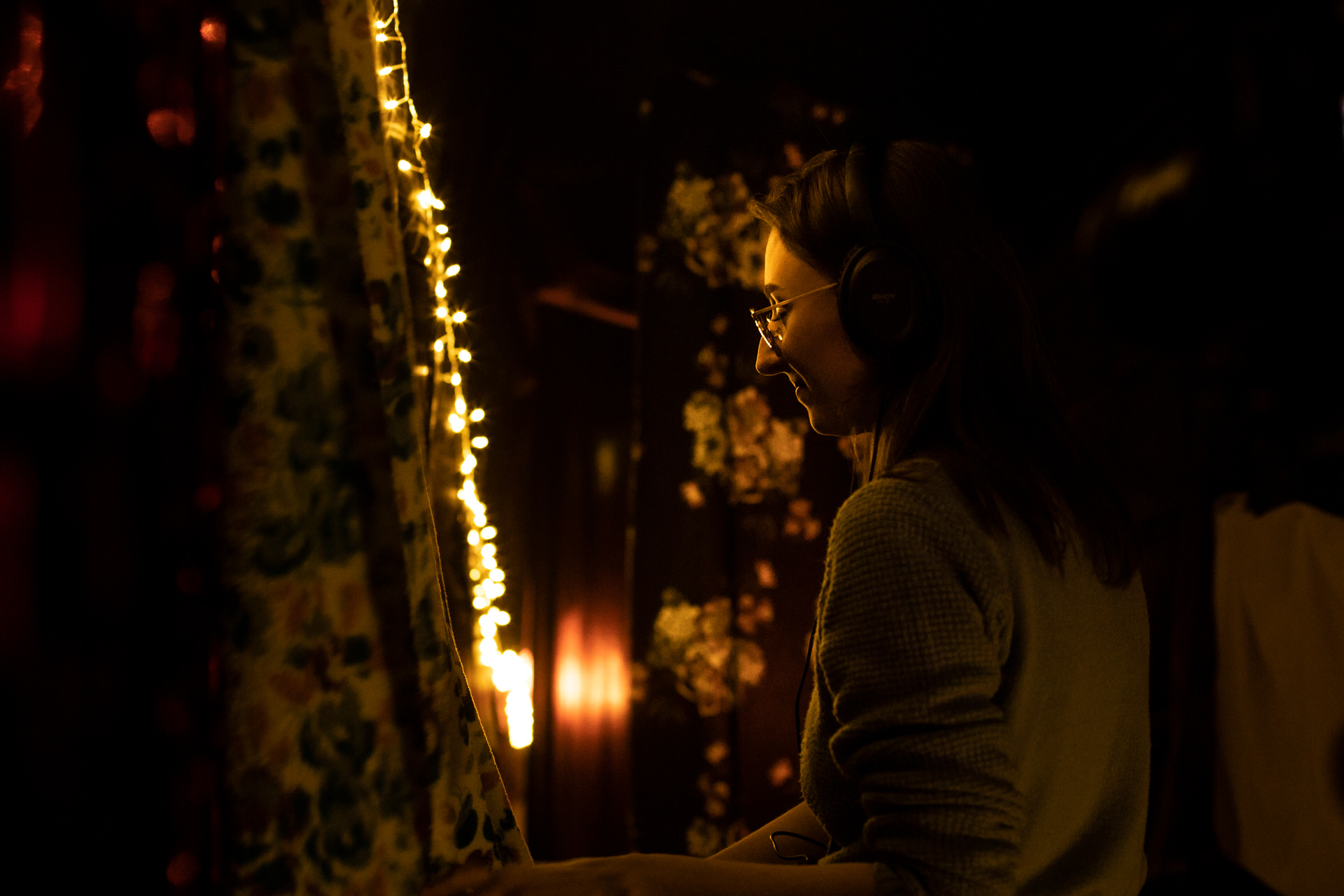 An audience member at the Self, Sense, Space installation with headphones on.