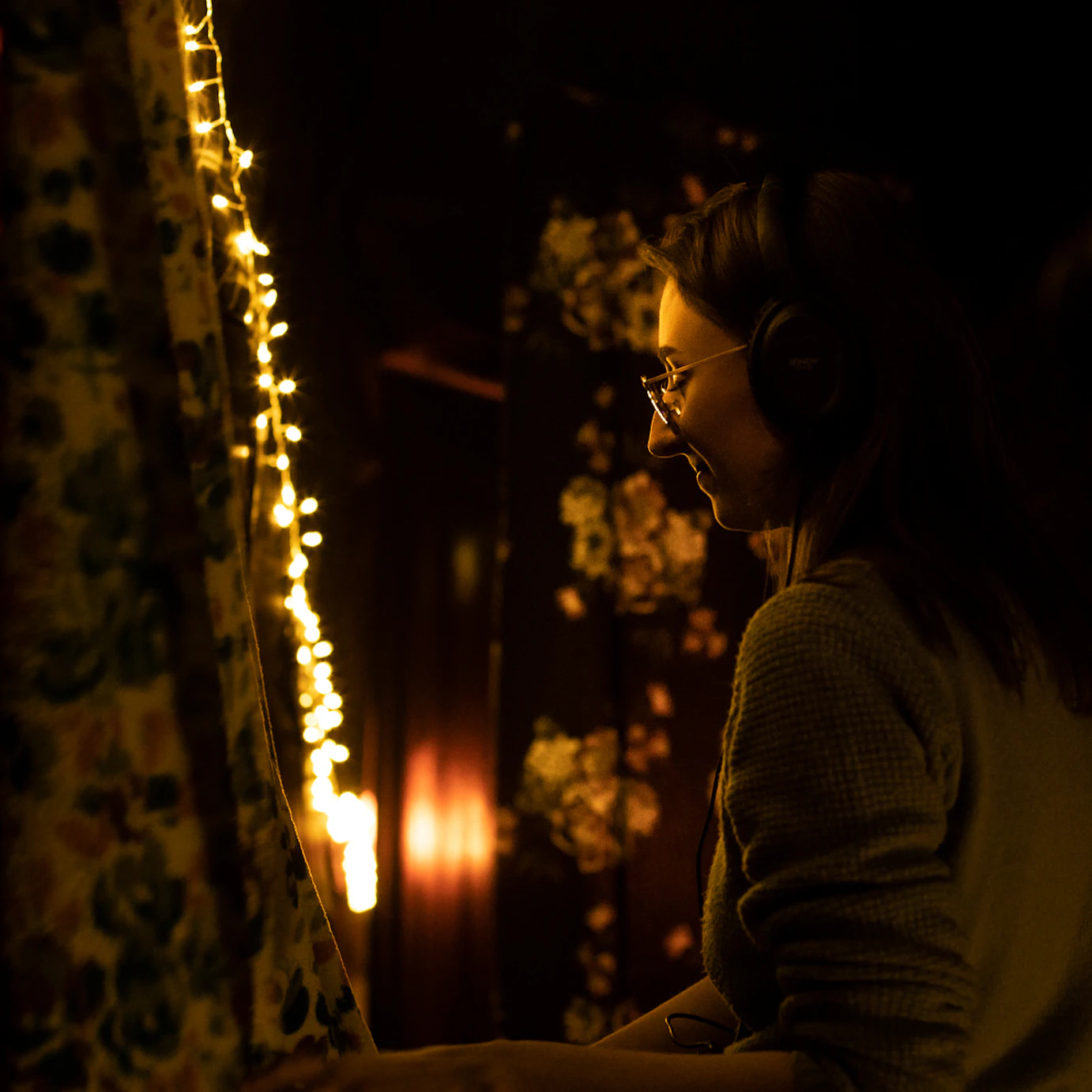 An audience member at the Self, Sense, Space installation with headphones on.