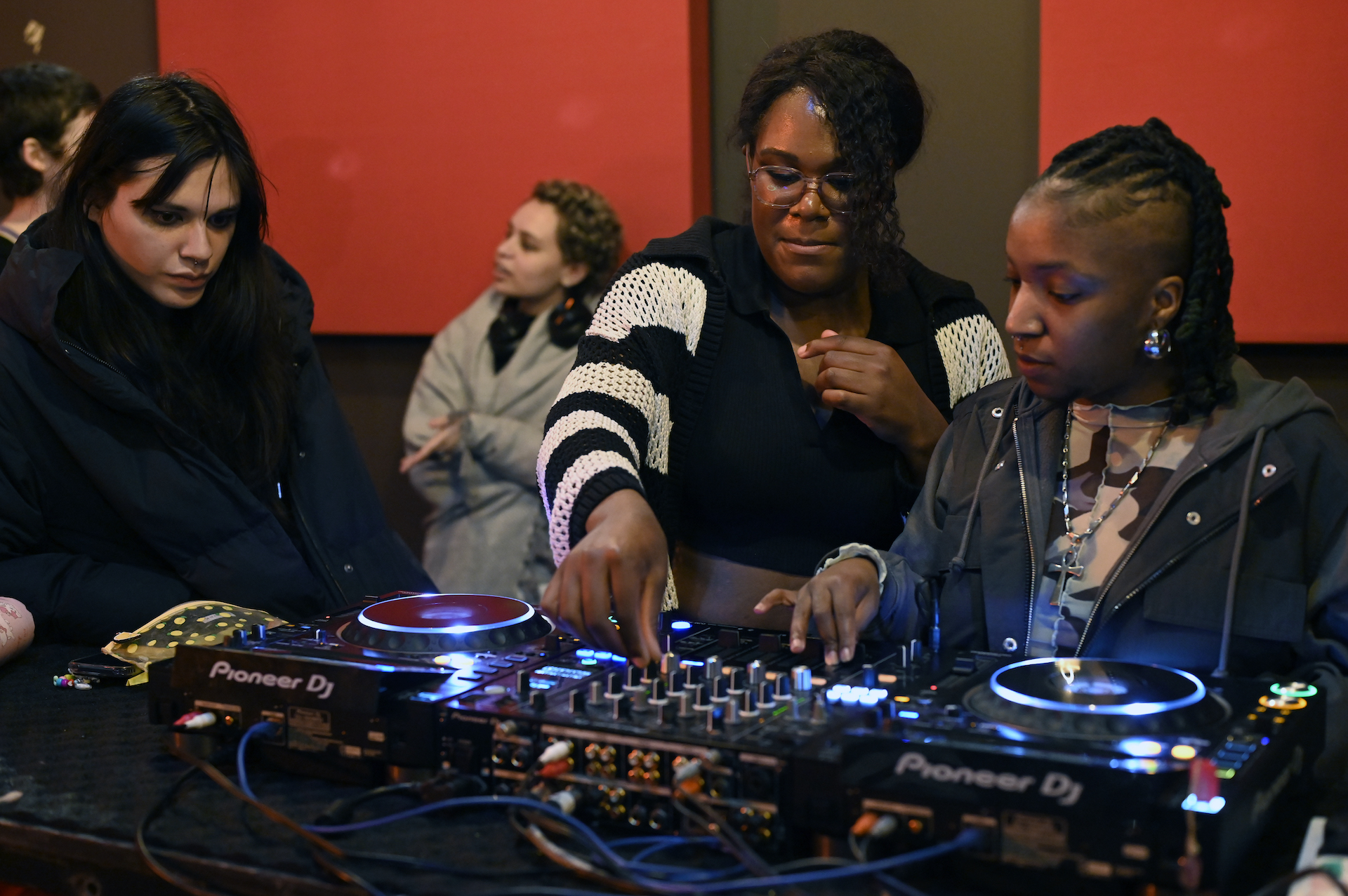 Guest artists Ifeoluwa and residency artists exploring sounds on DJ decks.