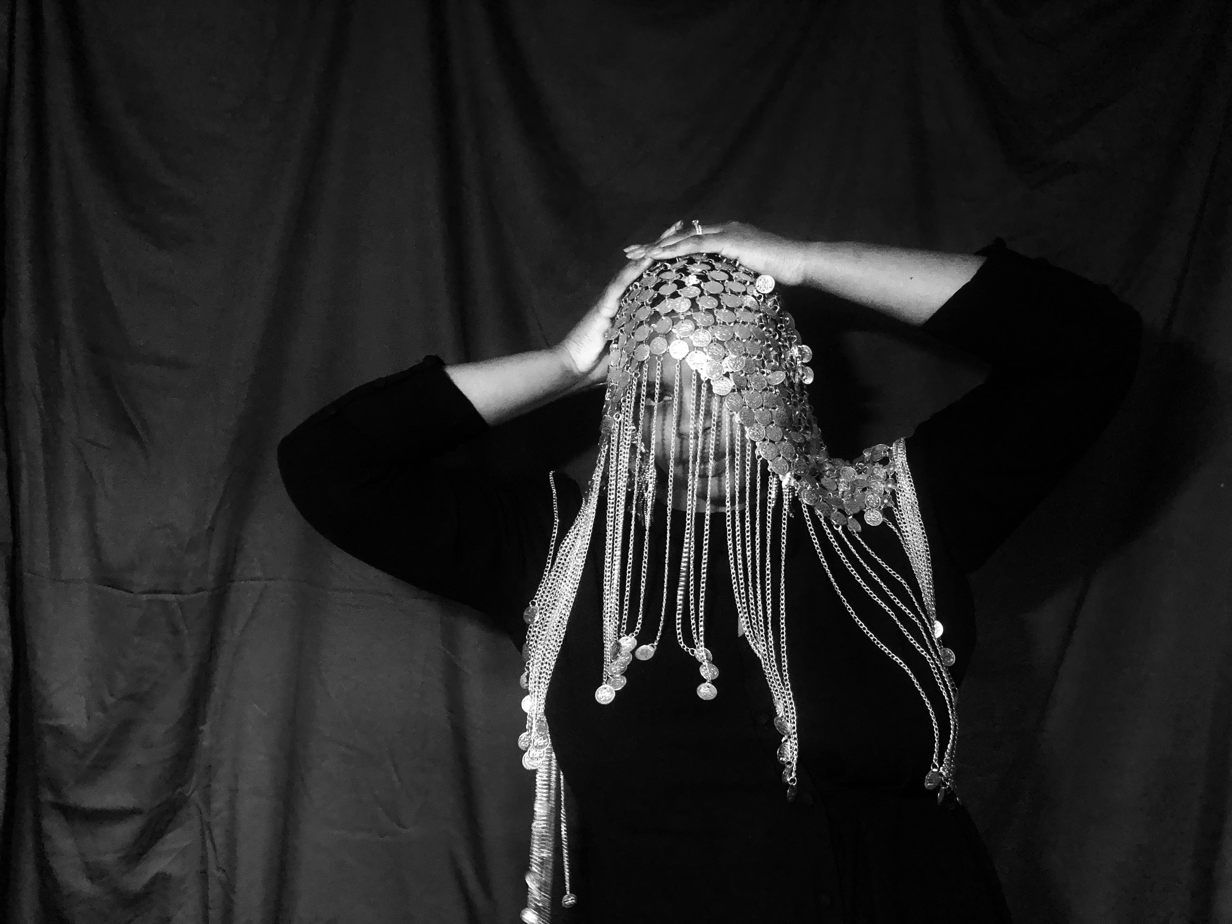Jebonair stood with her hands on her head looking into the camera.