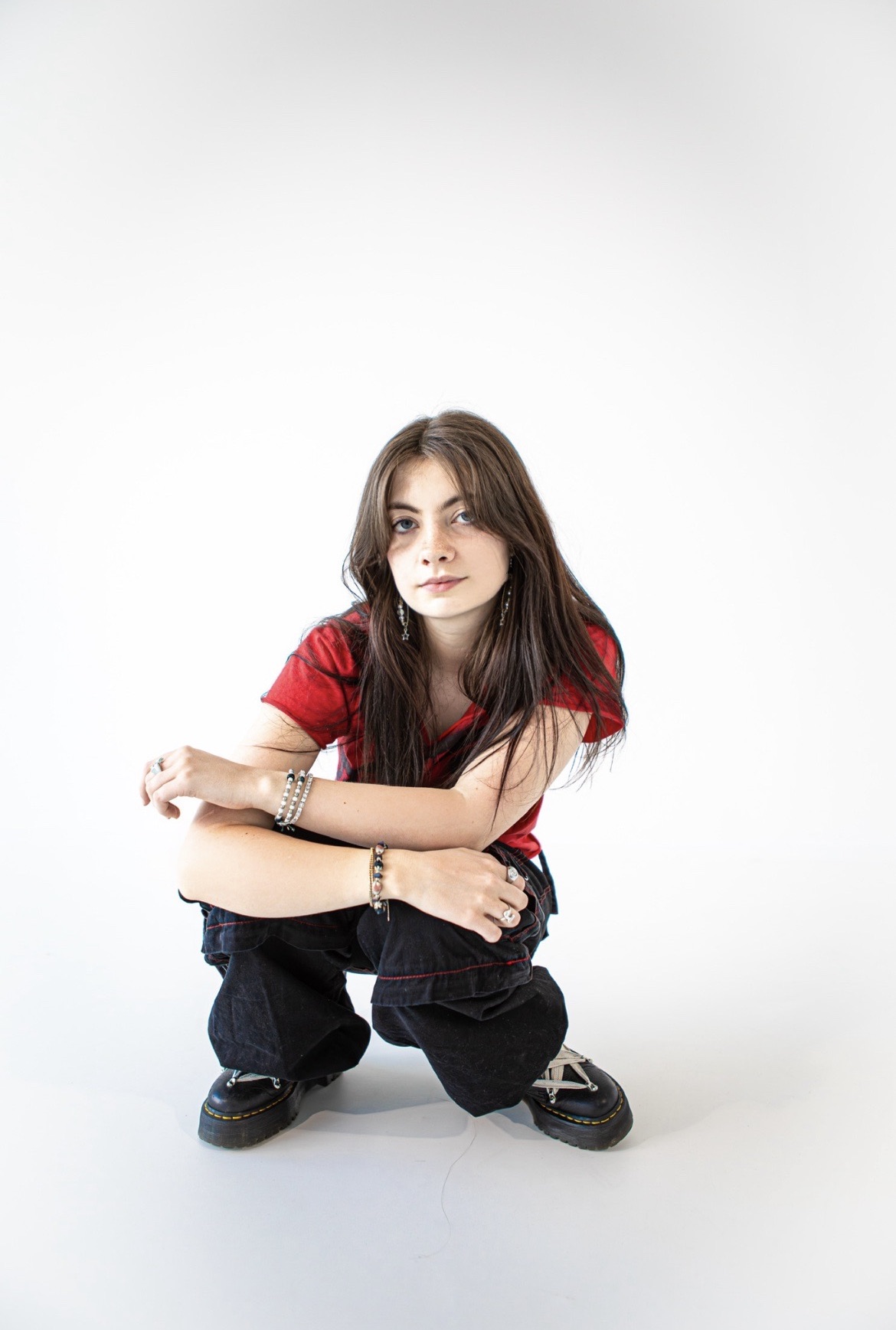 Jenni Orlopp knelt with her arms leaning on her knees.